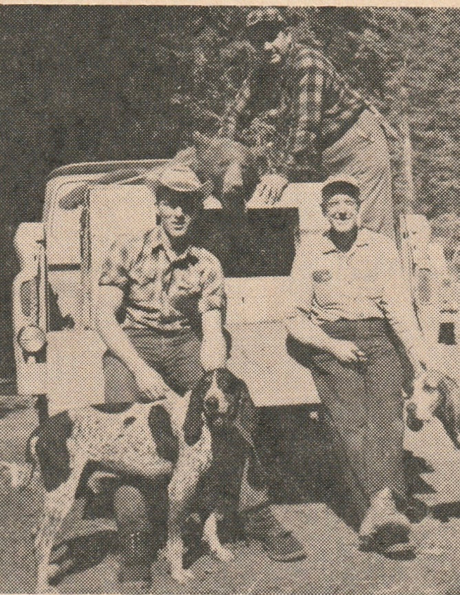 Al Lynn and Friends with two big game hounds and a bear they harvested.